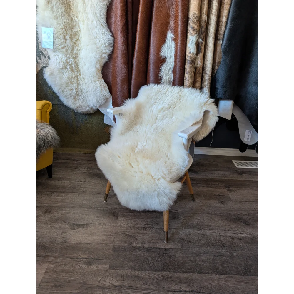 Gorgeous Merino sheepskins rug with white sheepskin, wooden legs, eco friendly