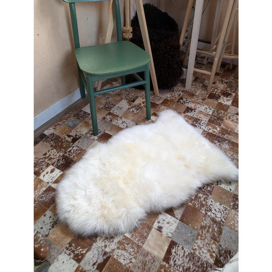 Gorgeous VERY SOFT Merino sheepskin rug, OEKO TEX certified, on checkered floor