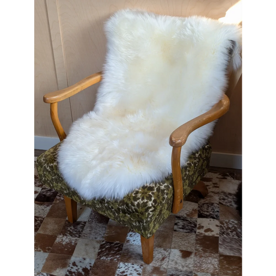 Gorgeous Merino sheepskin throw on green armchair, OEKO TEX certified