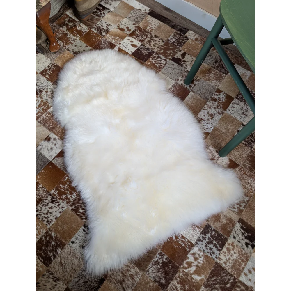 Gorgeous Merino sheepskin rug on cowhide floor, OEKO TEX certified