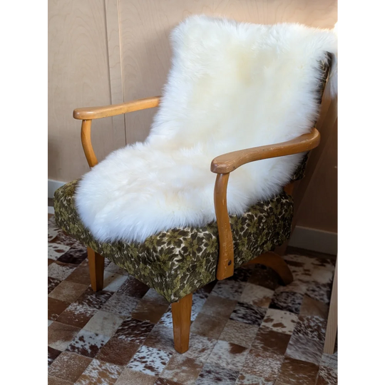 Gorgeous Merino sheepskin throw on green armchair, OEKO TEX certified