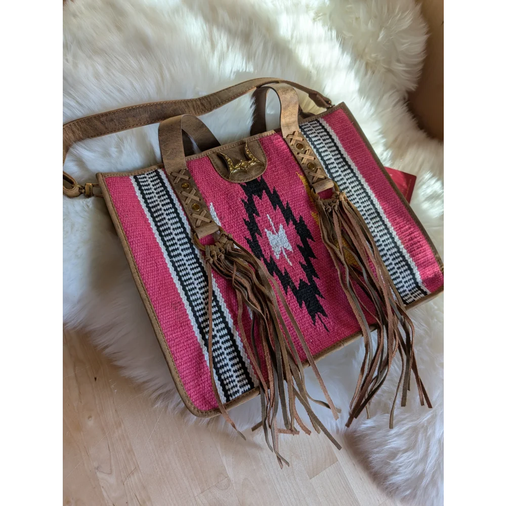A gorgeous pink wool country medium bag with hand-tooled leather accents and black white geometric patterns
