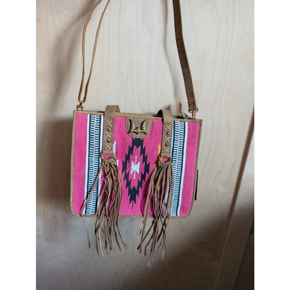 Gorgeous wool and leather bag with pink wool, hand-tooled leather accents, tan straps, and fringe detailing