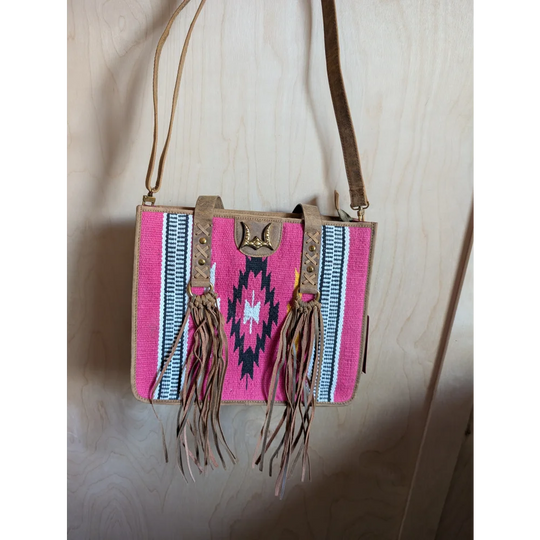 Gorgeous wool and leather bag with pink wool, hand-tooled leather accents, tan straps, and fringe detailing