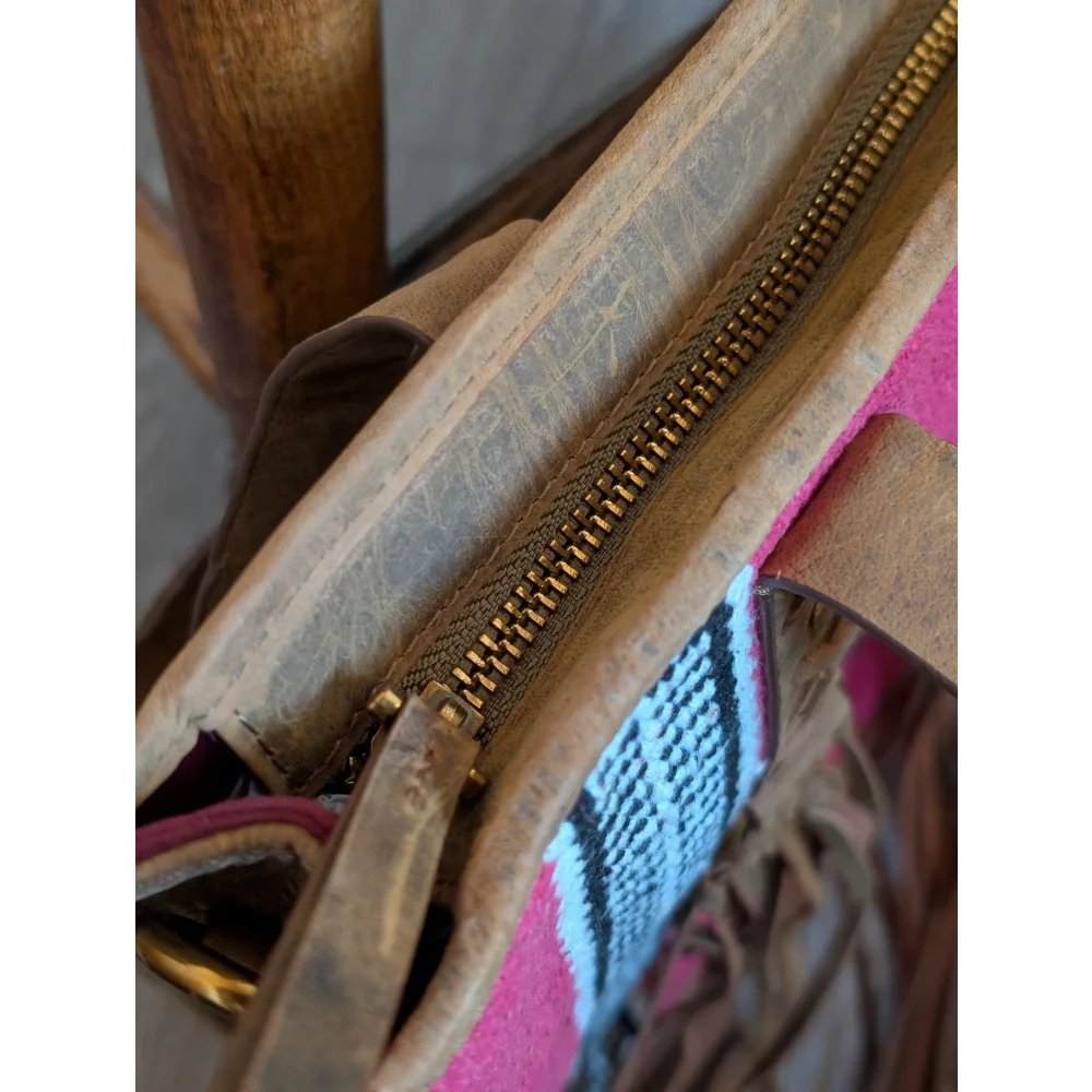 Gorgeous wool and leather bag with worn tan leather, gold zipper, hand-tooled leather accents, and pink wool lining