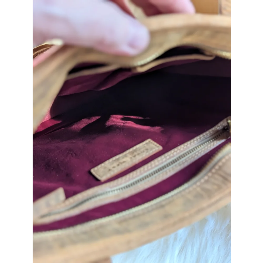 Gorgeous wool and leather bag with tan hand-tooled leather accents, plush maroon interior, and gold zipper details