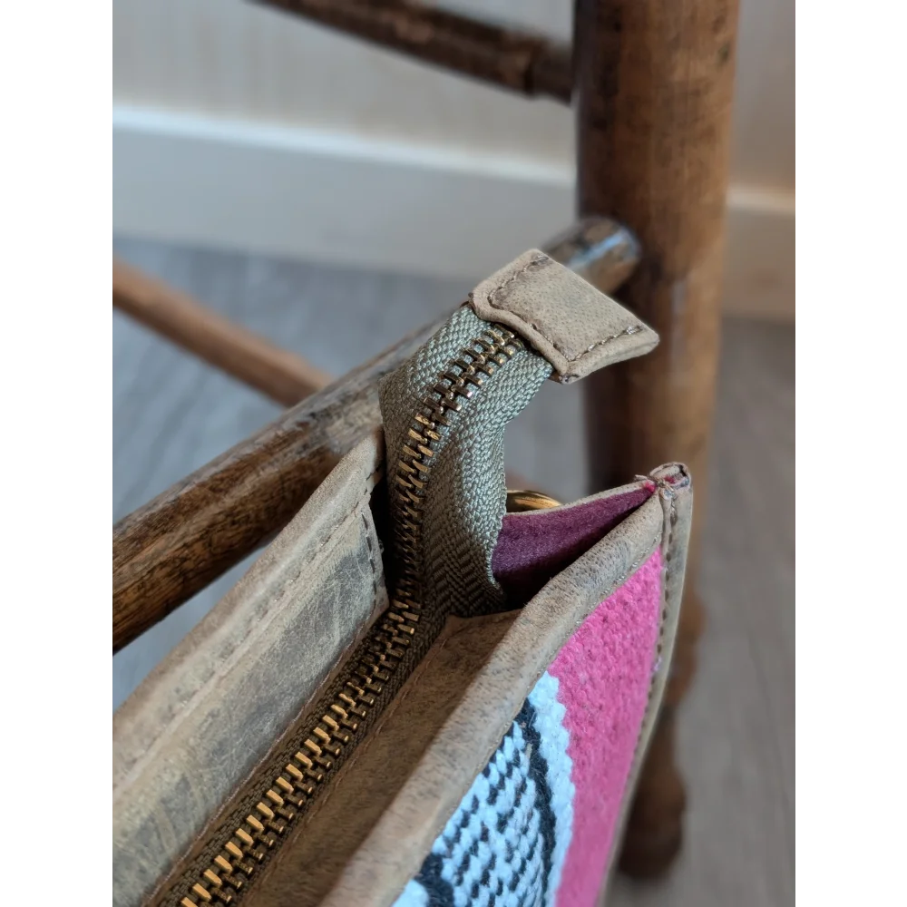 Gorgeous wool and leather bag with pink wool woven pattern, hand-tooled leather accents, and beige trim