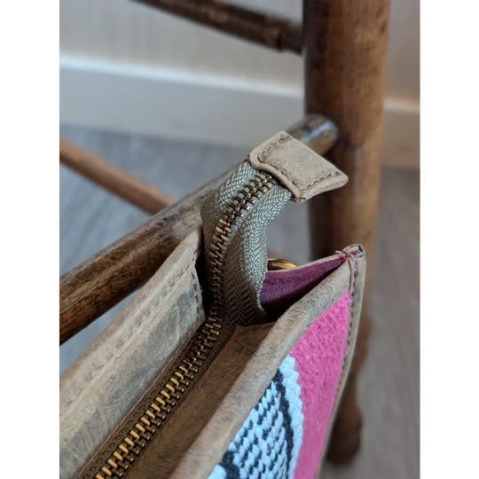 Gorgeous wool and leather bag with pink wool woven pattern, hand-tooled leather accents, and beige trim