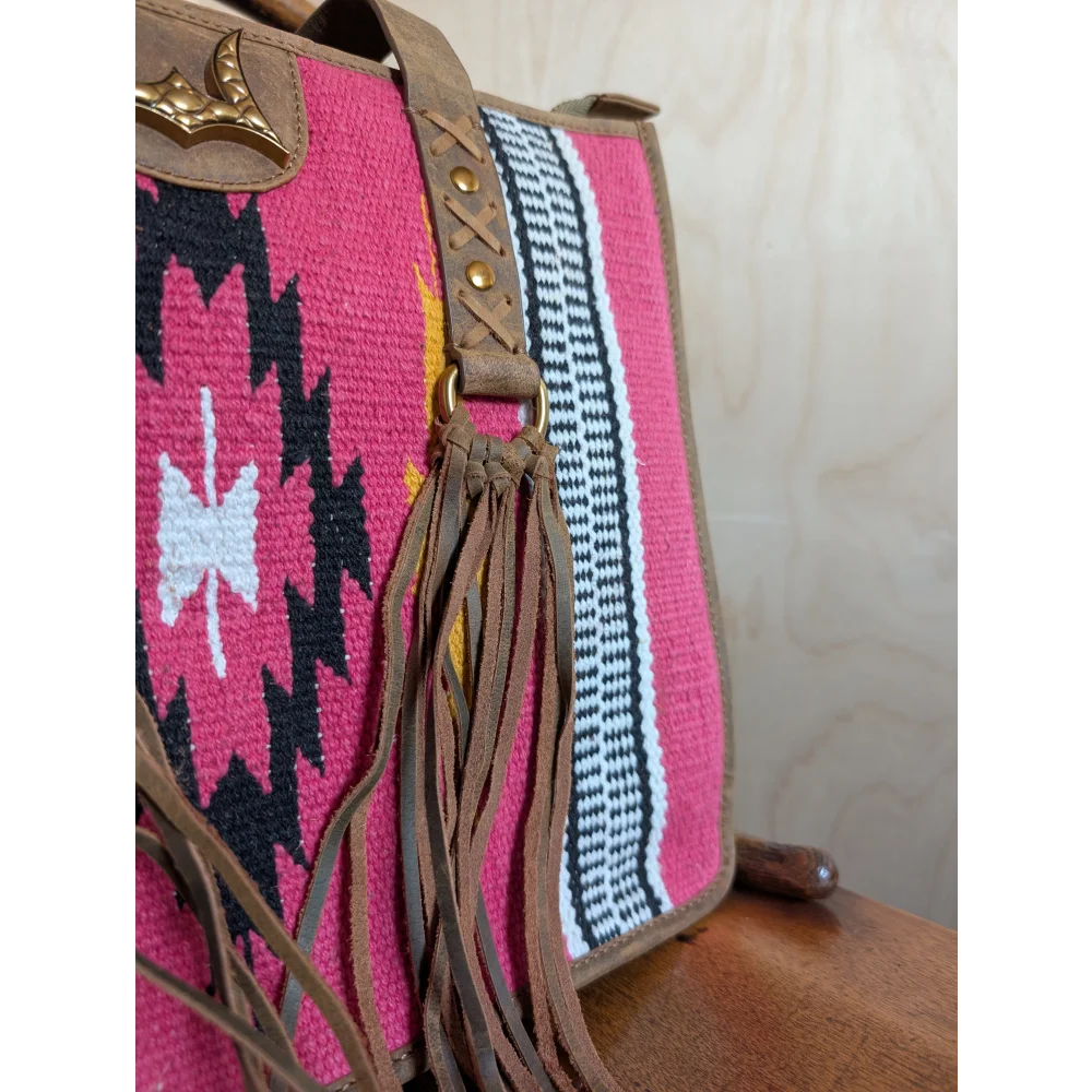 Gorgeous wool and leather bag with vibrant pink wool, bold geometric patterns, and hand-tooled leather accents