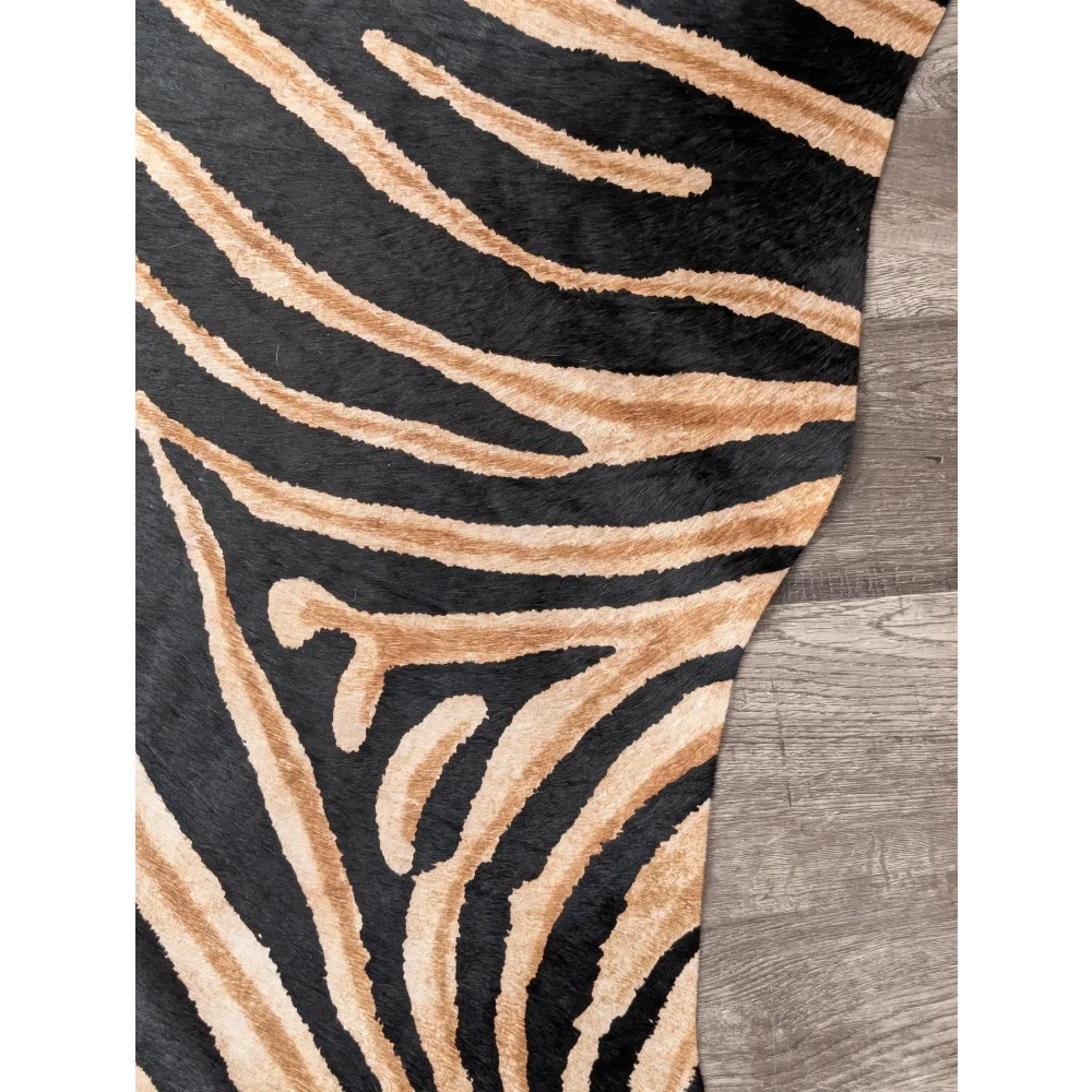 Gorgeous zebra printed cowhide rug by angus oliver with black and tan zebra print and soft textured faux fur surface