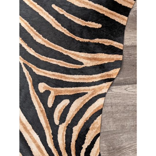 Gorgeous zebra printed cowhide rug by angus oliver with black and tan zebra print and soft textured faux fur surface