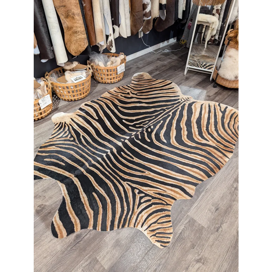 Gorgeous zebra printed large cowhide rug with bold black and tan stripes showcasing unique characteristics by angus oliver