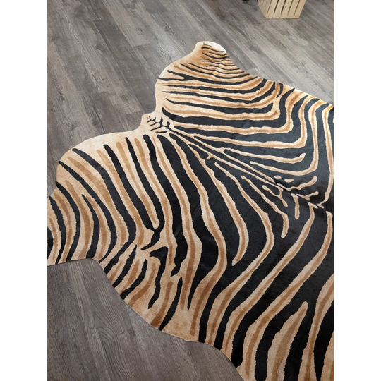 A plush angus oliver large cowhide rug with bold black and tan zebra print and unique characteristics