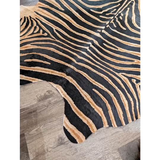 Gorgeous zebra printed cowhide rug with black and tan zebra stripes and unique characteristics by angus oliver