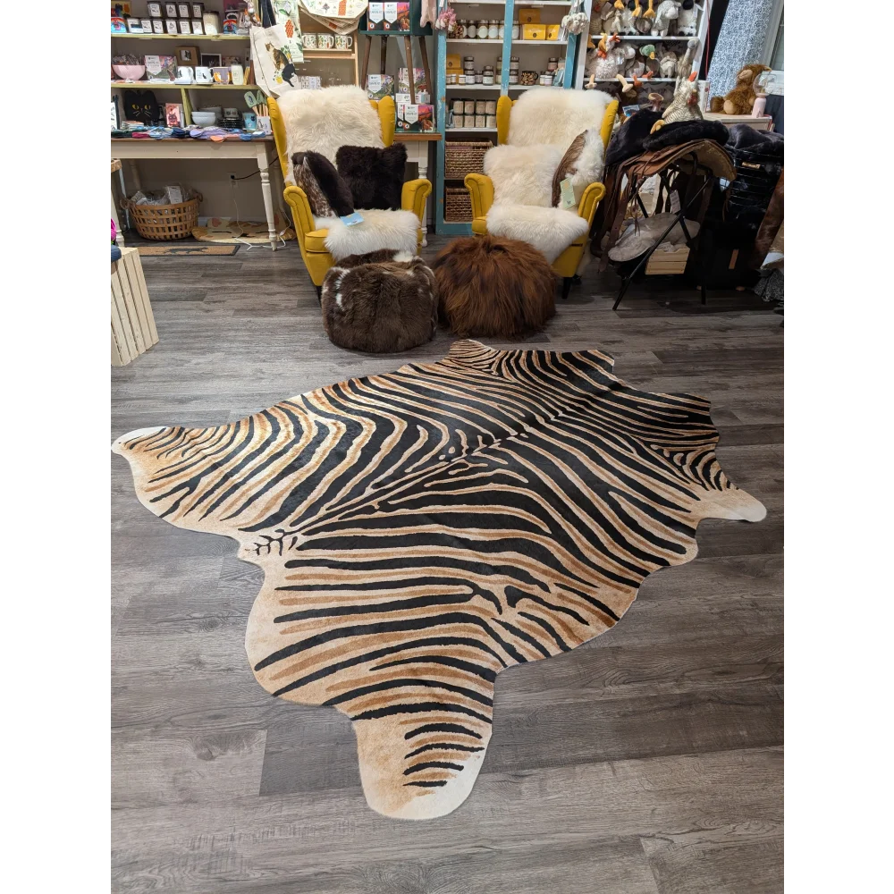 Gorgeous zebra printed large angus oliver cowhide rug with bold black and tan stripes and unique characteristics