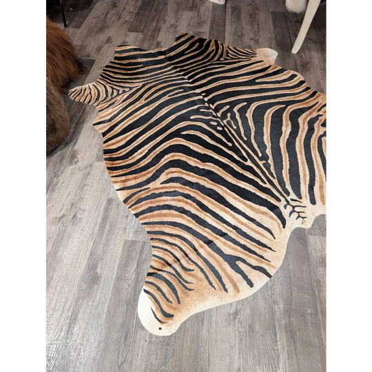 Gorgeous zebra printed large cowhide rug by angus oliver with bold black and tan stripes and unique characteristics