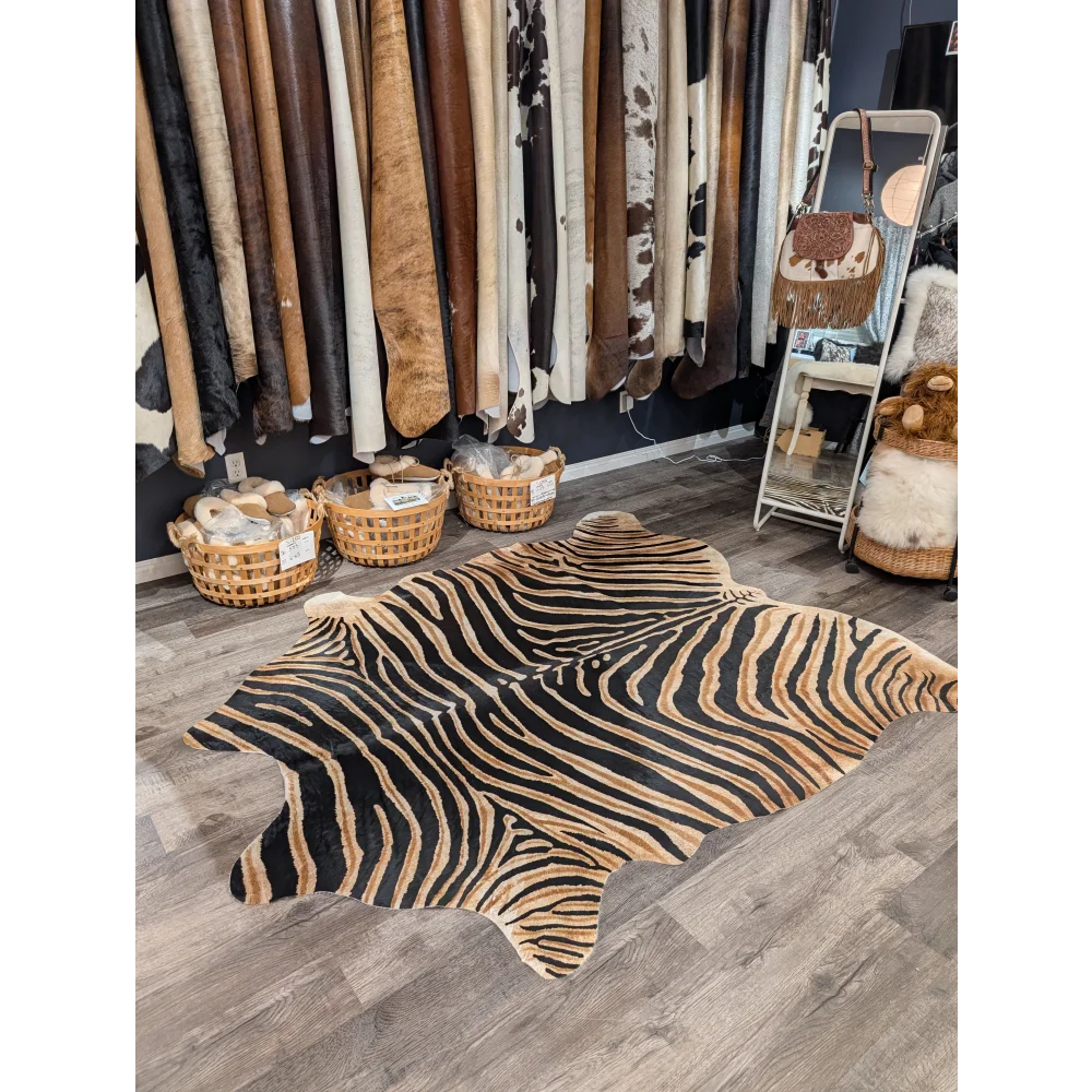 Black and tan zebra printed cowhide rug with unique characteristics from angus oliver large cowhide collection