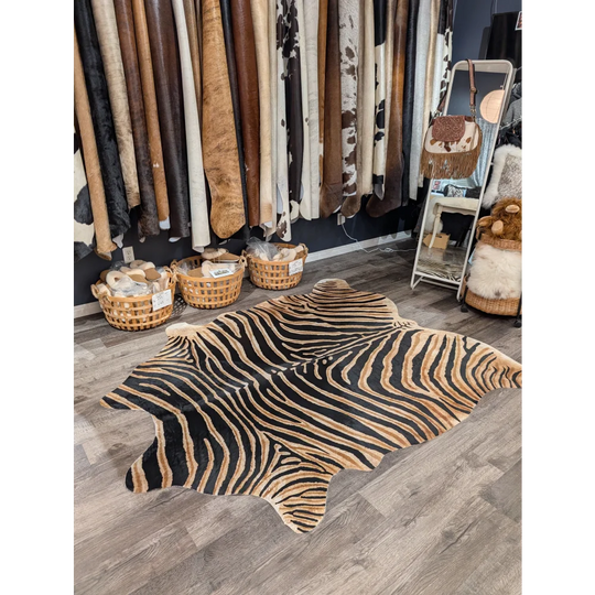 Black and tan zebra printed cowhide rug with unique characteristics from angus oliver large cowhide collection