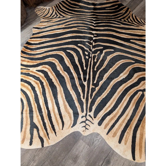 Gorgeous zebra printed cowhide rug by angus oliver with bold black and tan stripes and unique large cowhide characteristics