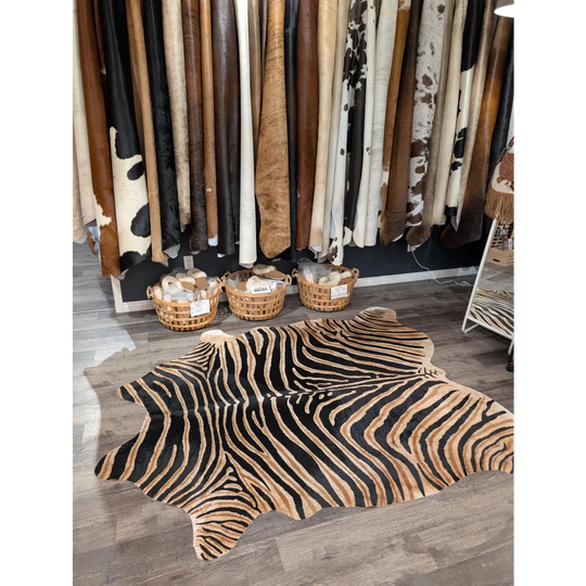 Gorgeous zebra printed large cowhide rug with bold black and tan stripes showcasing unique characteristics by angus oliver