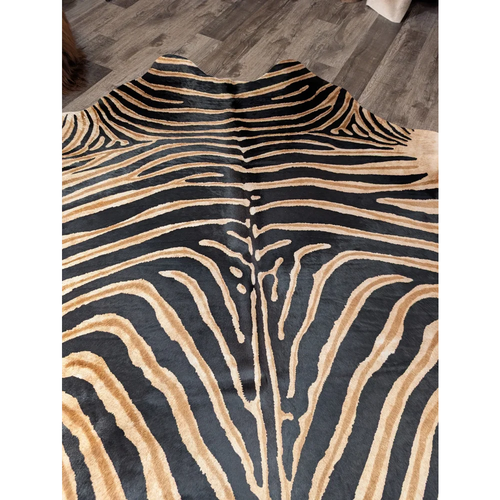 Gorgeous zebra printed large cowhide rug with black and tan zebra print and unique angus oliver characteristics