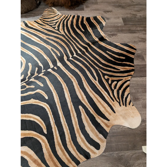 Black and tan zebra striped large cowhide rug with natural fur edge by angus oliver showing unique characteristics