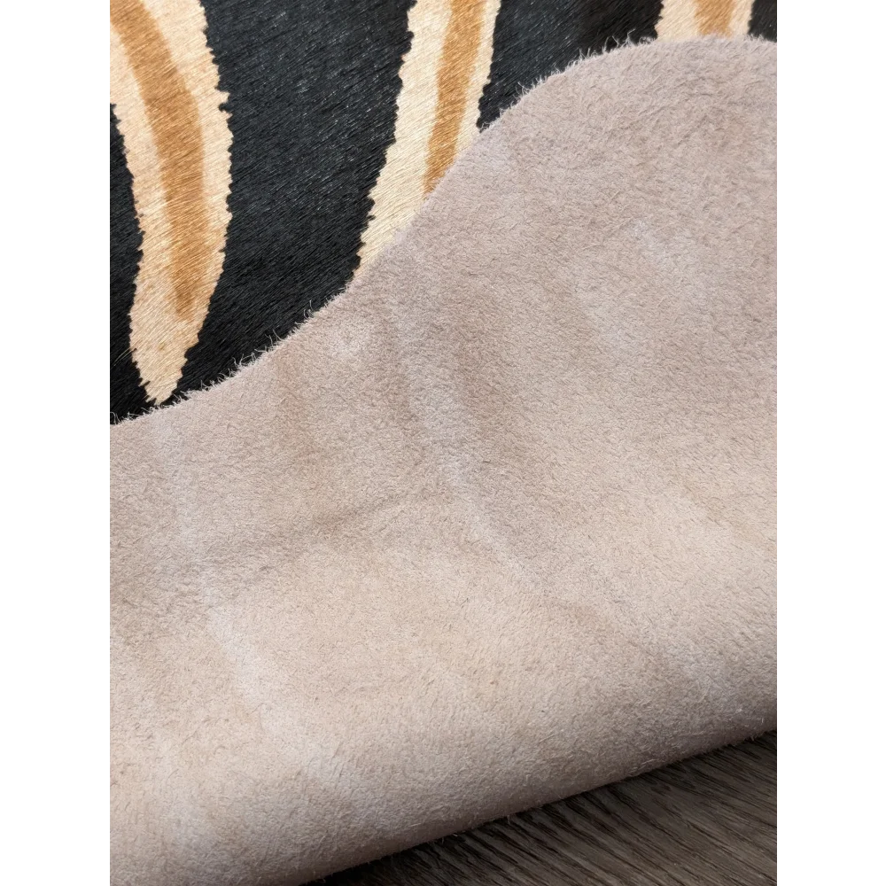Beige suede fabric with soft plush texture and fuzzy surface showing unique characteristics in angus oliver large cowhide