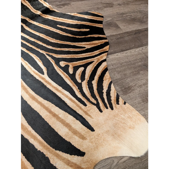 Black and tan zebra striped large cowhide rug by angus oliver with unique characteristics and natural textured surface