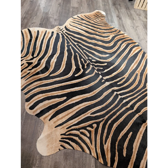 Gorgeous zebra printed cowhide in black and tan with natural fur texture showcasing unique characteristics by angus oliver