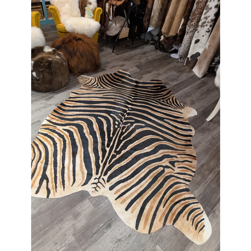 Gorgeous zebra printed large cowhide rug by angus oliver with bold black and tan stripes showing unique characteristics