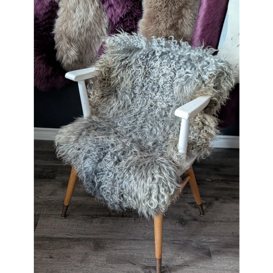 Gotland sheepskin gray armchair with wooden legs and white plastic arms, 44x30 inches
