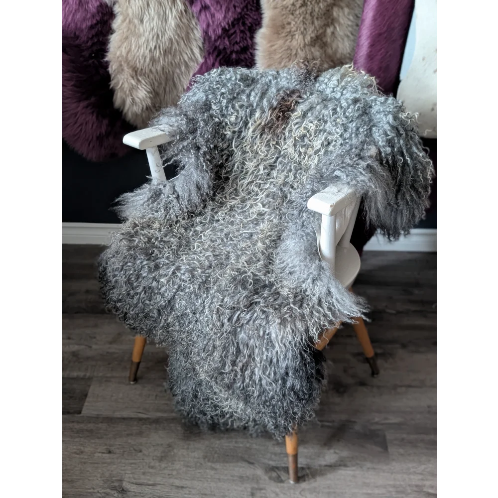 Gray Gotland sheepskin throw blanket 52x31 on white frame chair