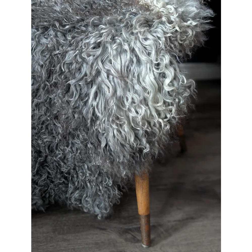 Gotland sheepskin rug 52x31 with wooden legs and metal feet