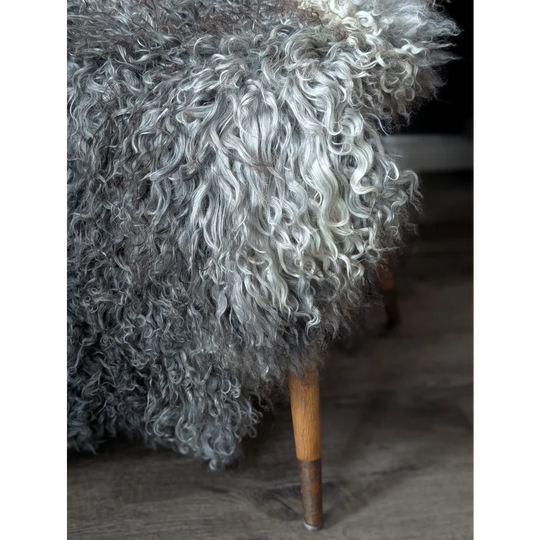 Gotland sheepskin rug 52x31 with wooden legs and metal feet