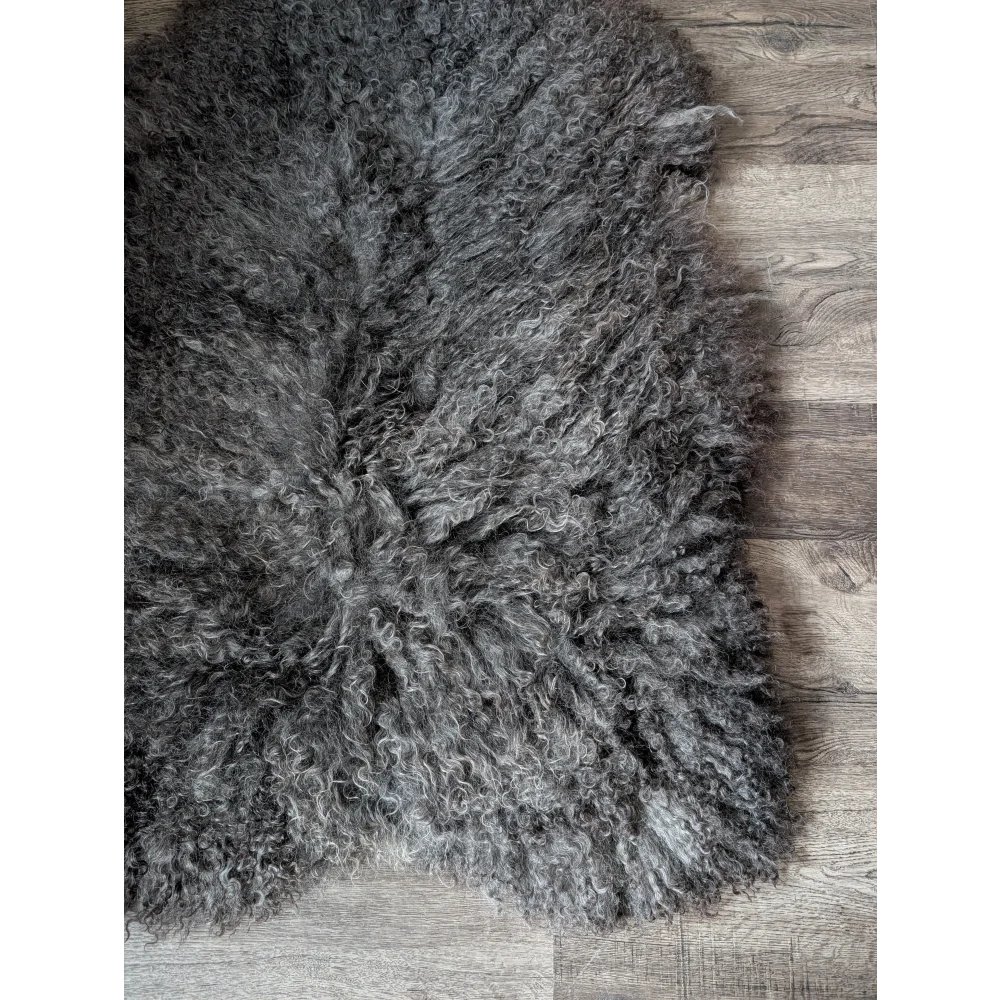 Gotland sheepskin rug 52x31 with gray natural texture and fringed edges