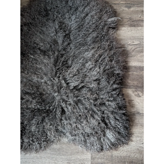 Gotland sheepskin rug 52x31 with gray natural texture and fringed edges
