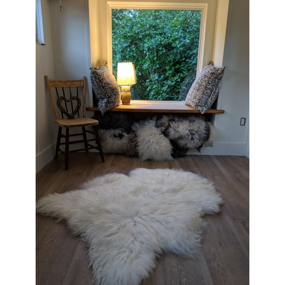 Grade a white icelandic sheepskin rug 53x34 inches with soft fluffy texture and natural irregular shape