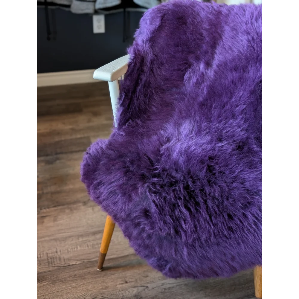 Gorgeous grape purple merino sheepskin faux fur chair with wooden legs