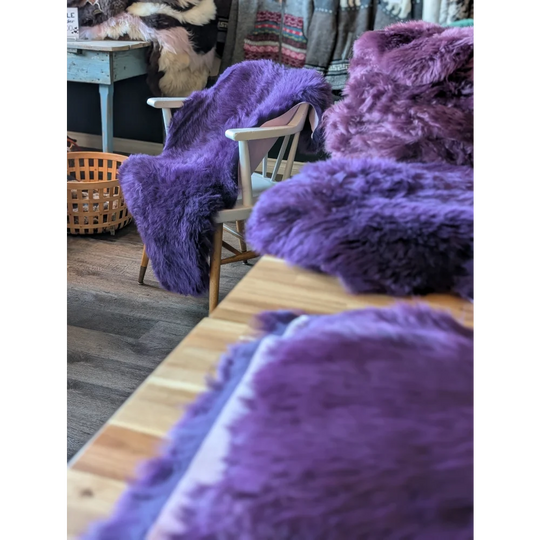 Gorgeous grape purple merino sheepskin faux fur throw, shaggy and vibrant