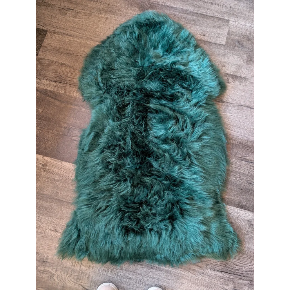 Gorgeous green Merino sheepskin rug with soft natural fur texture