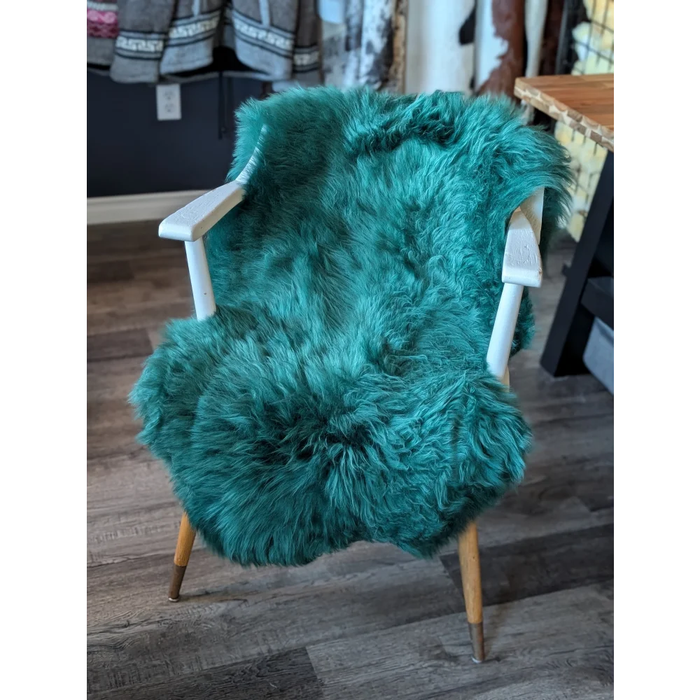 Teal faux fur armchair with gorgeous merino sheepskins