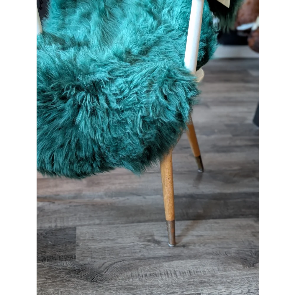 Gorgeous green merino sheepskin teal fur chair with wooden legs