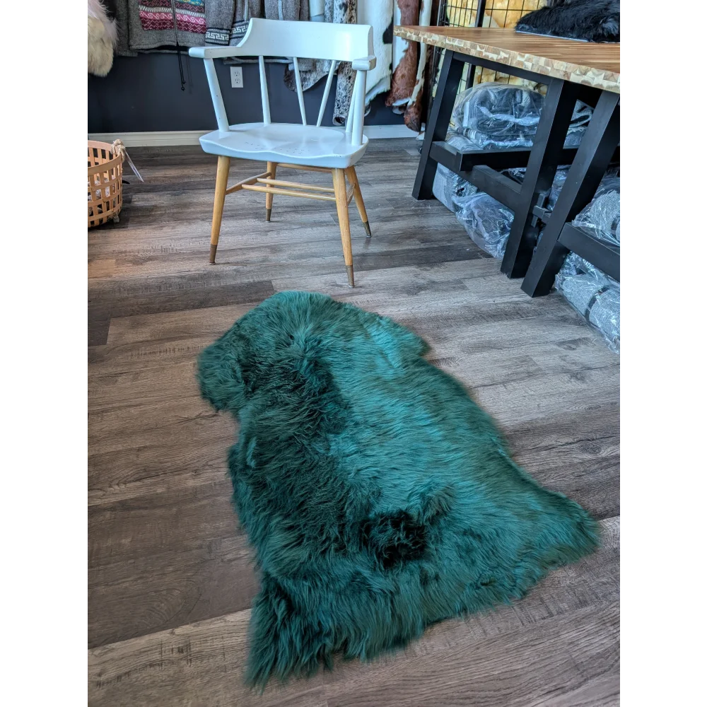 Gorgeous teal merino sheepskin throw with black accents, eco friendly
