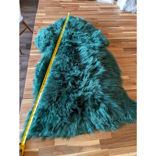Gorgeous green merino sheepskin rug with luxurious teal fur texture