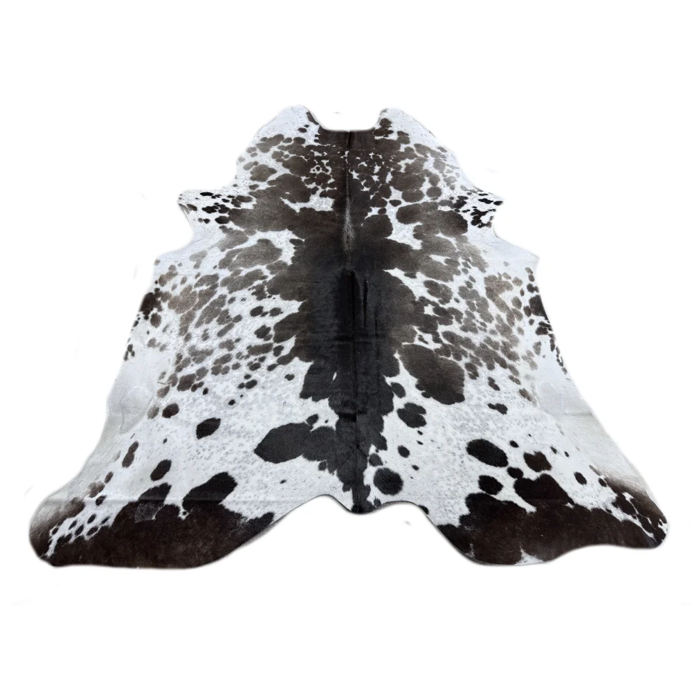 Beautiful extra large cowhide rug in black and white spots with natural irregular edges perfect for large cowhide decor