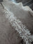 A beautiful extra large gray and white cowhide rug greymix925 with a distinctive spotted pattern perfect for large cowhide decor