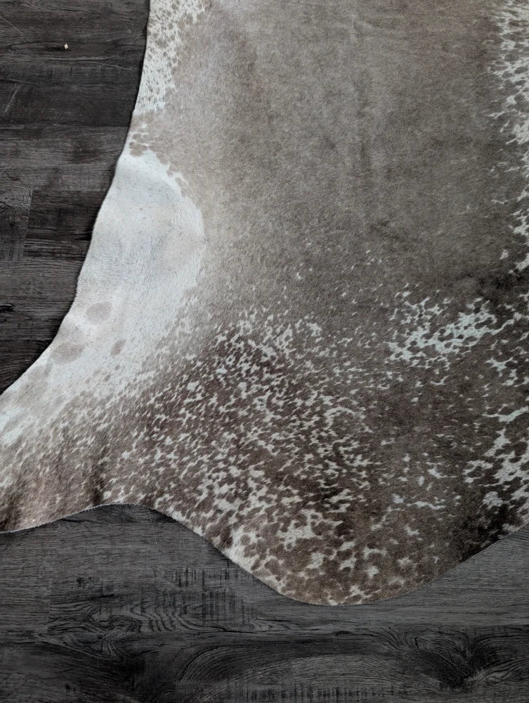 Greymix#925 extra large cowhide rug in natural brown and white speckled pattern on dark wood flooring perfect for beautiful rugs