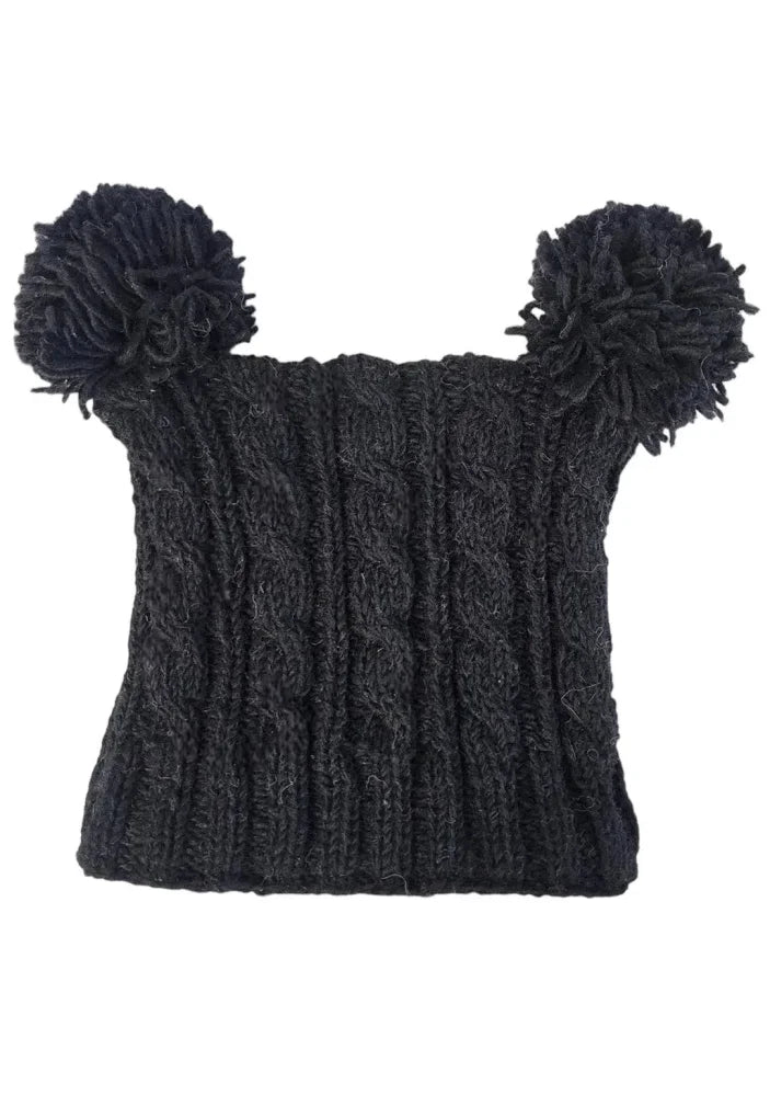 Black knitted heelah double pompom hat with cable knit pattern and fluffy double pompom accents on top