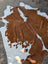 Large brown and white cowhide rug hello1 with unique irregular fur patches perfect for beautiful rugs