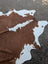 Hello1 large brown and white cowhide rug with natural irregular edges showcases unique characteristics for beautiful rugs